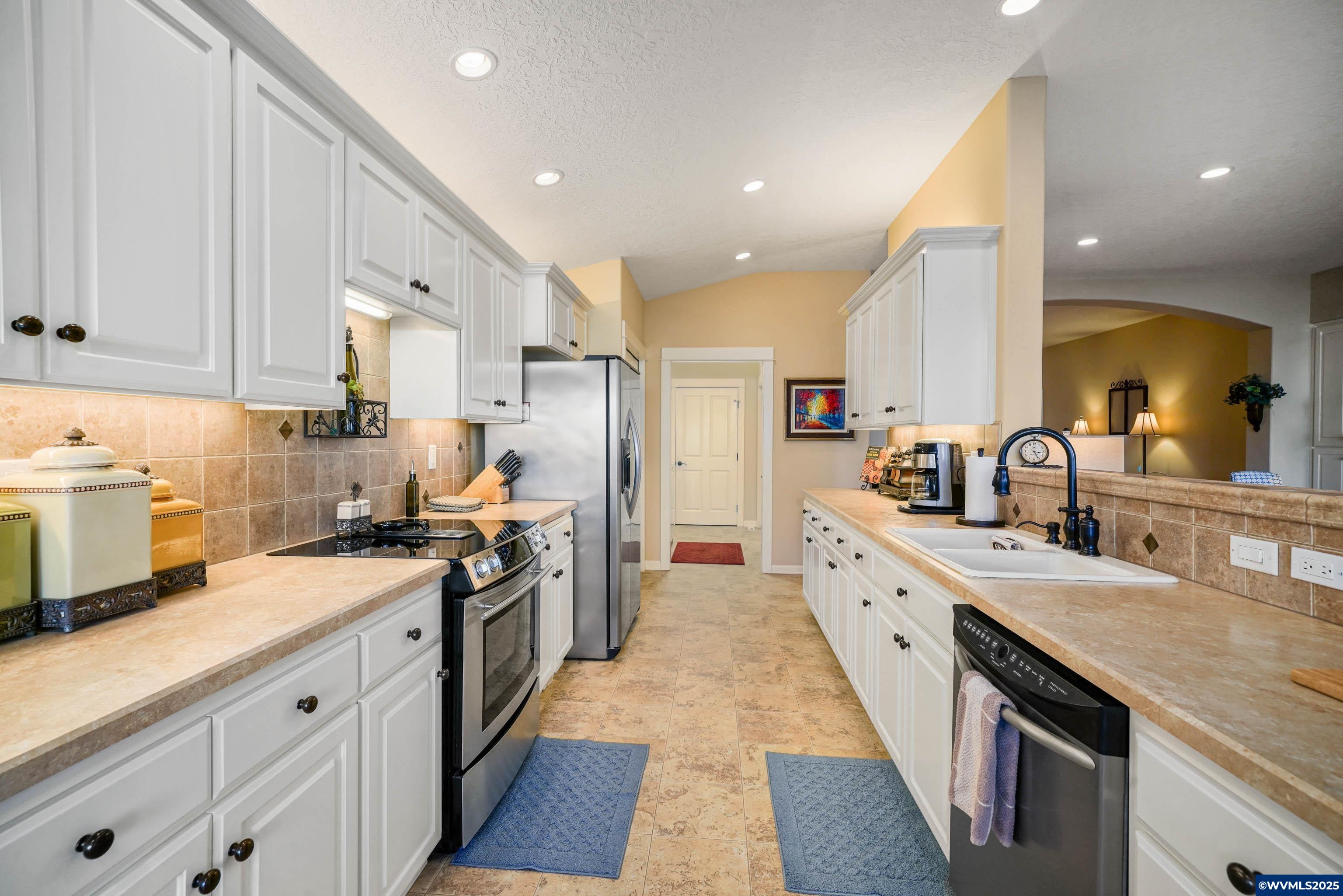 2224 Southeast Rhododendron Avenue Dallas, OR 97338 - Photo 23 of 38 a large kitchen with a large counter top appliances and cabinets