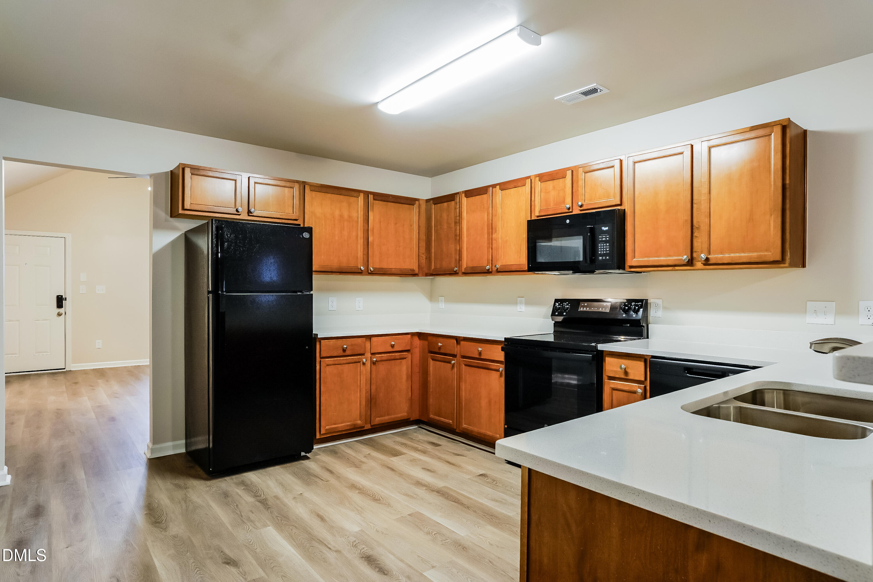 3405 Mogollon Court Raleigh, NC 27610 - Photo 5 of 16 a kitchen with a refrigerator stove and sink