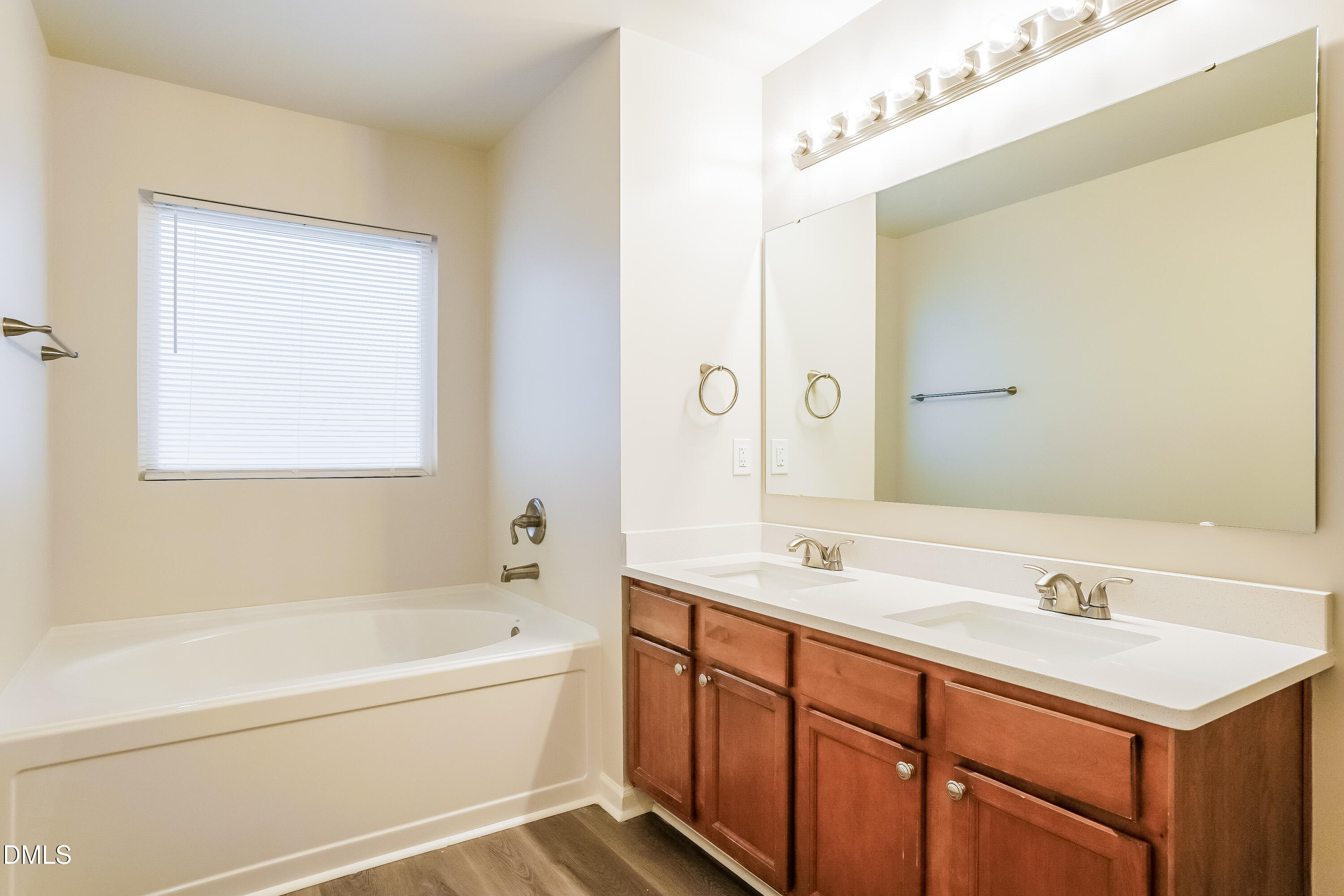 3405 Mogollon Court Raleigh, NC 27610 - Photo 9 of 16 a bathroom with a tub sink and mirror
