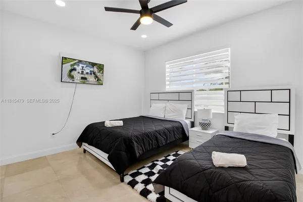 a bedroom with a bed and window