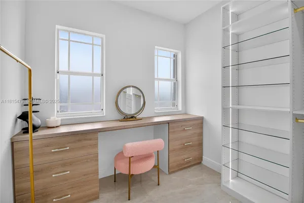 a room with cabinets and a chair