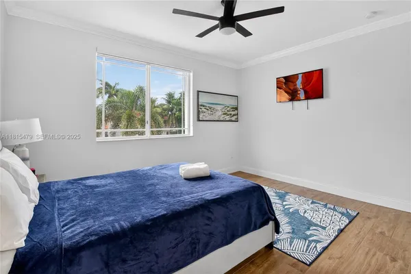 a bedroom with bed and window