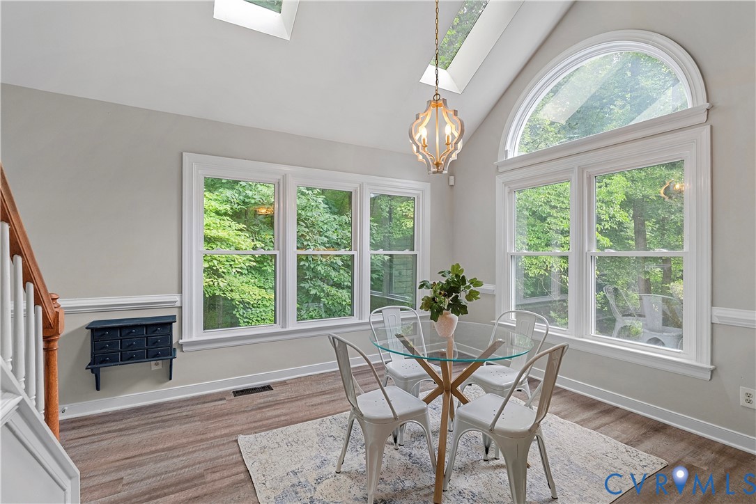14308 Chimney House Road Midlothian, VA 23112 - Photo 22 of 52 Dining area featuring multiple windows, a large ar