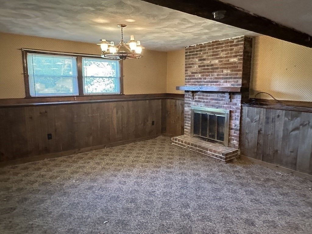 2 Monticello Circle Billerica, MA 01821 - Photo 16 of 19 a view of empty room with fireplace and windows