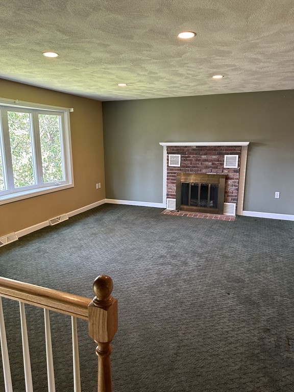 2 Monticello Circle Billerica, MA 01821 - Photo 19 of 19 a view of empty room with fireplace and windows
