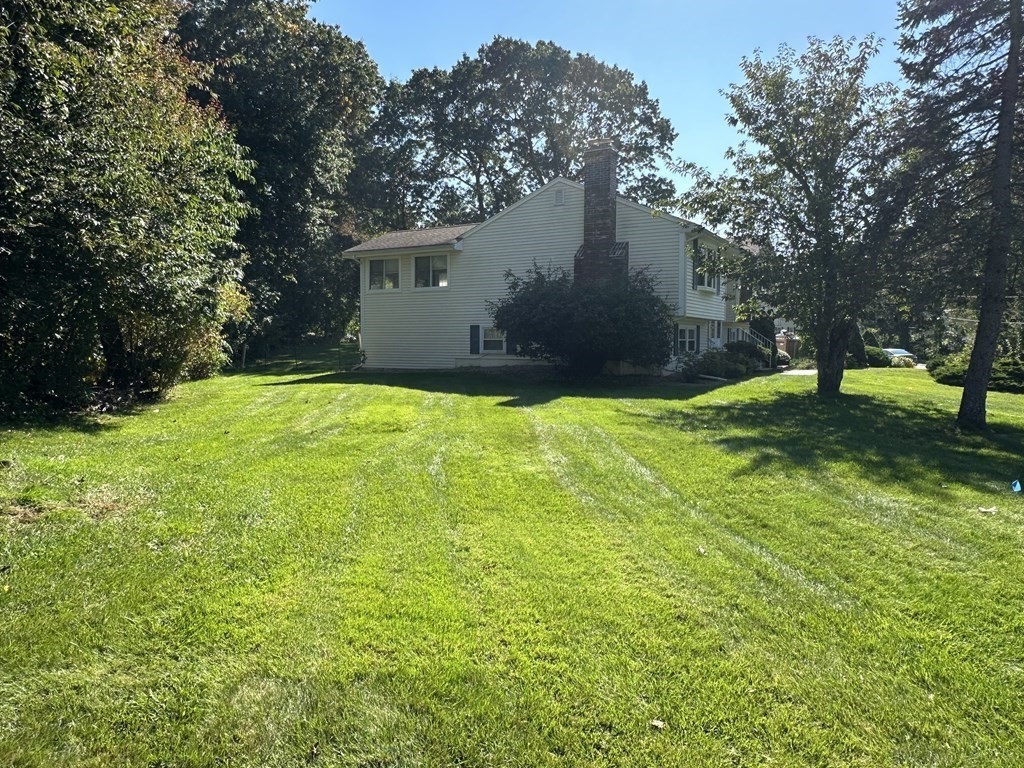 2 Monticello Circle Billerica, MA 01821 - Photo 2 of 19 a view of a backyard with a house