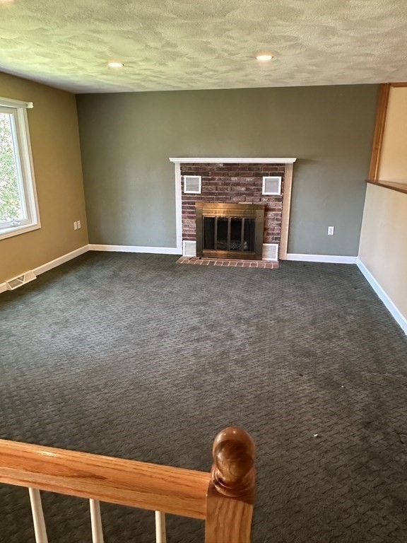 2 Monticello Circle Billerica, MA 01821 - Photo 8 of 19 a room with a fireplace