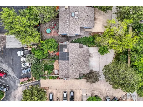 an aerial view of a house with outdoor space and street view