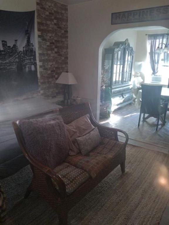 1772 Nostrand Avenue Brooklyn, NY 11226 - Photo 16 of 22 a living room with furniture and a chandelier