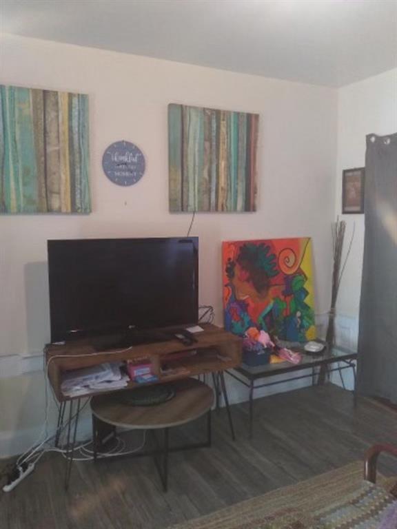 1772 Nostrand Avenue Brooklyn, NY 11226 - Photo 17 of 22 a living room with furniture and a flat screen tv