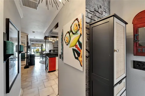 a kitchen with stainless steel appliances a stove a sink and cabinets