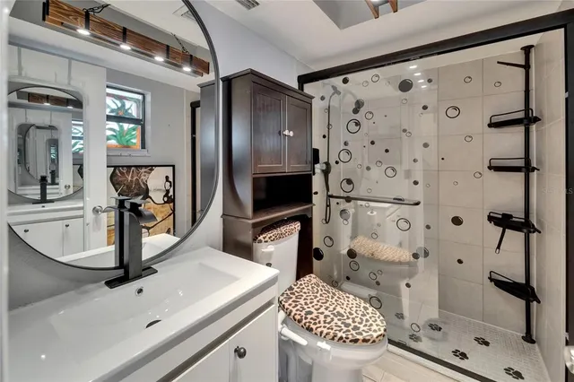 a kitchen with a sink a counter and chairs