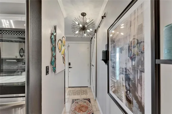 a bedroom with a bed and a television