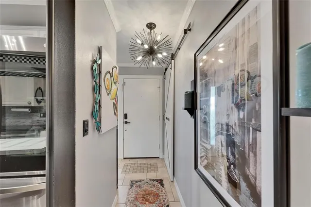 a bedroom with a bed and a television