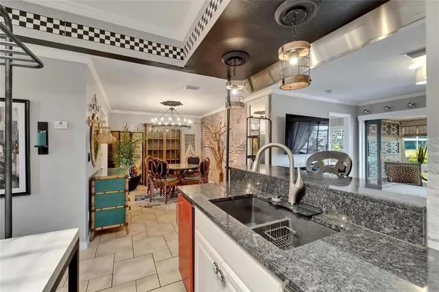 a bedroom with a bed and a television