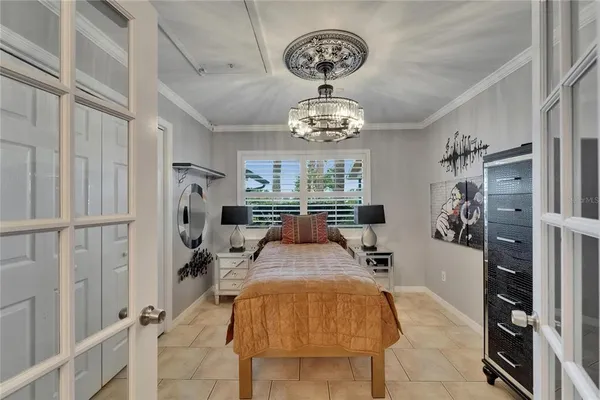 a view of a living room and a dining table with chairs