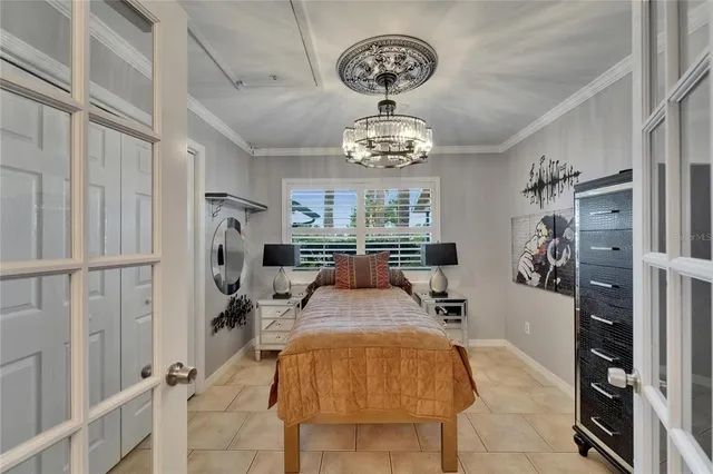 a view of a living room and a dining table with chairs