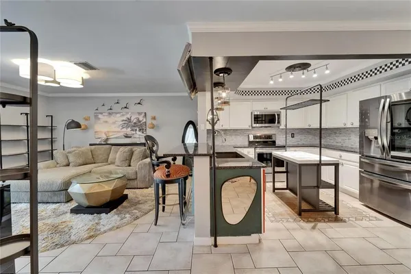 a bedroom with a bed and cabinets