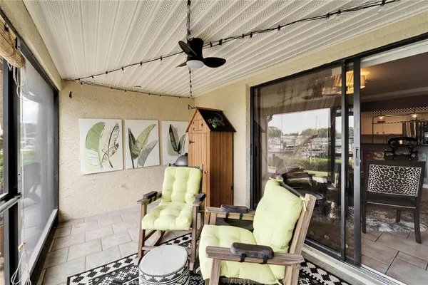 an aerial view of house with yard swimming pool and lake view