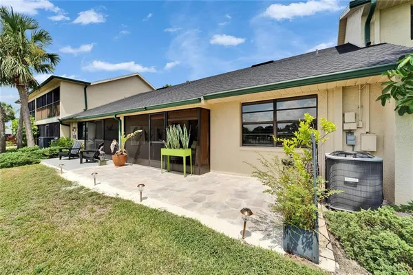 an aerial view of a house with a lake view
