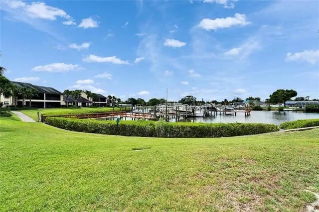 an aerial view of a house with a swimming pool and outdoor seating