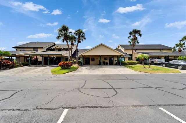 a kitchen with stainless steel appliances granite countertop a refrigerator and a stove