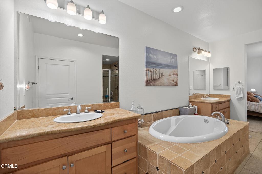 1423 Windshore Way Oxnard, CA 93035 - Photo 50 of 77 a bathroom with a sink double vanity and a mirror
