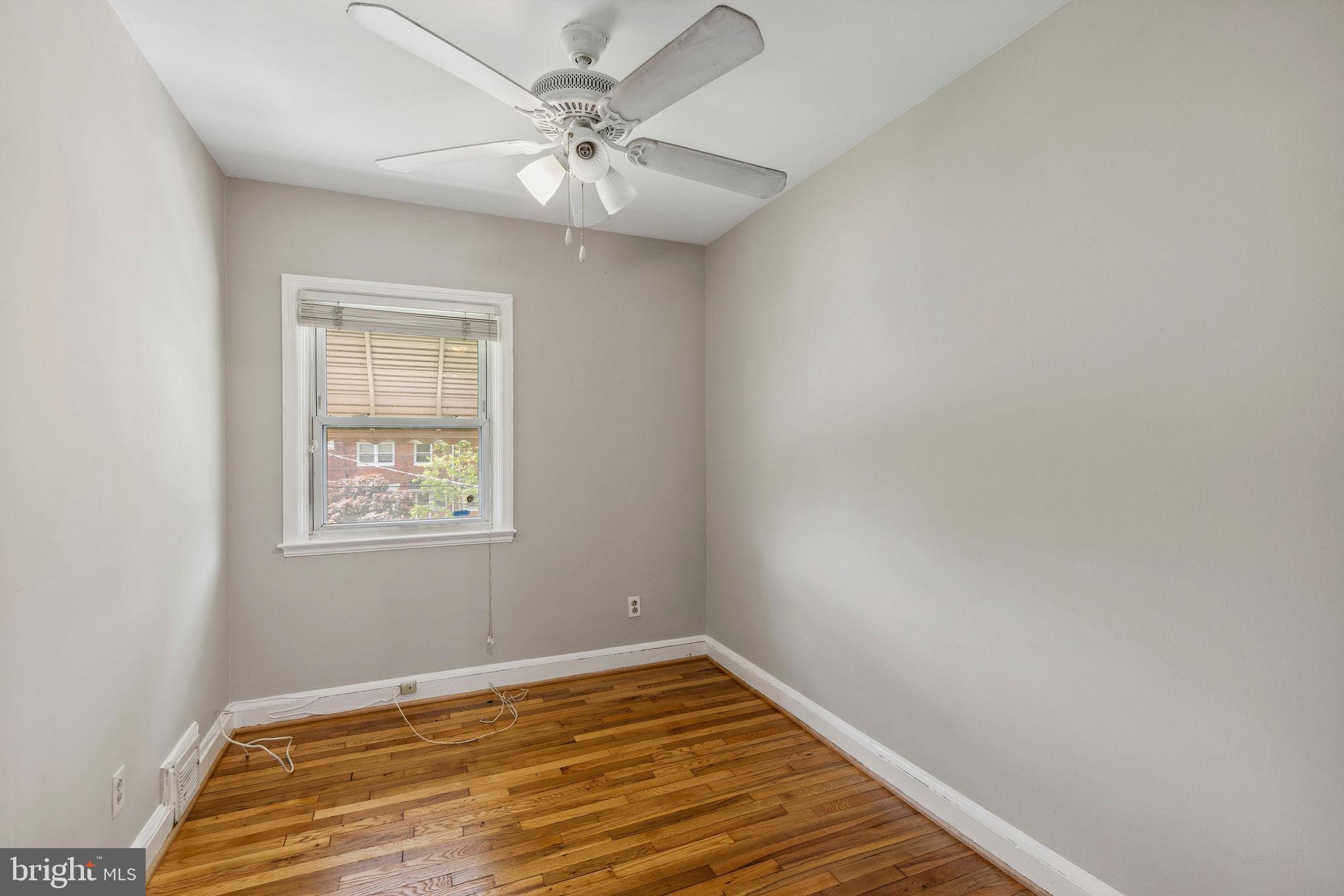 1581 Stonewood Road Baltimore, MD 21239 - Photo 16 of 21 an empty room with a window