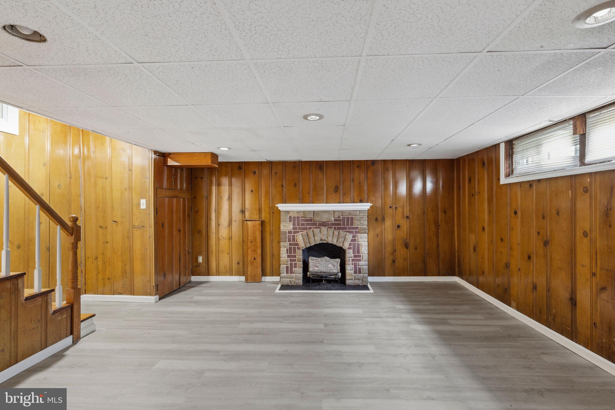 1581 Stonewood Road Baltimore, MD 21239 - Photo 18 of 21 a view of an empty room with fireplace and a window
