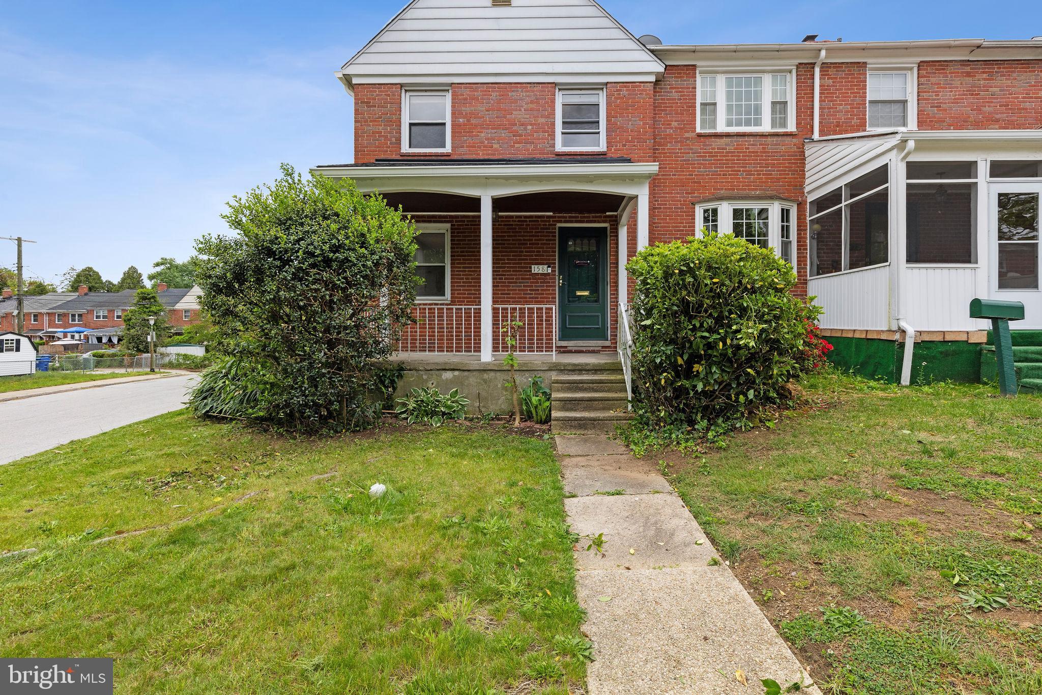 1581 Stonewood Road Baltimore, MD 21239 - Photo 3 of 21 a front view of a house with garden