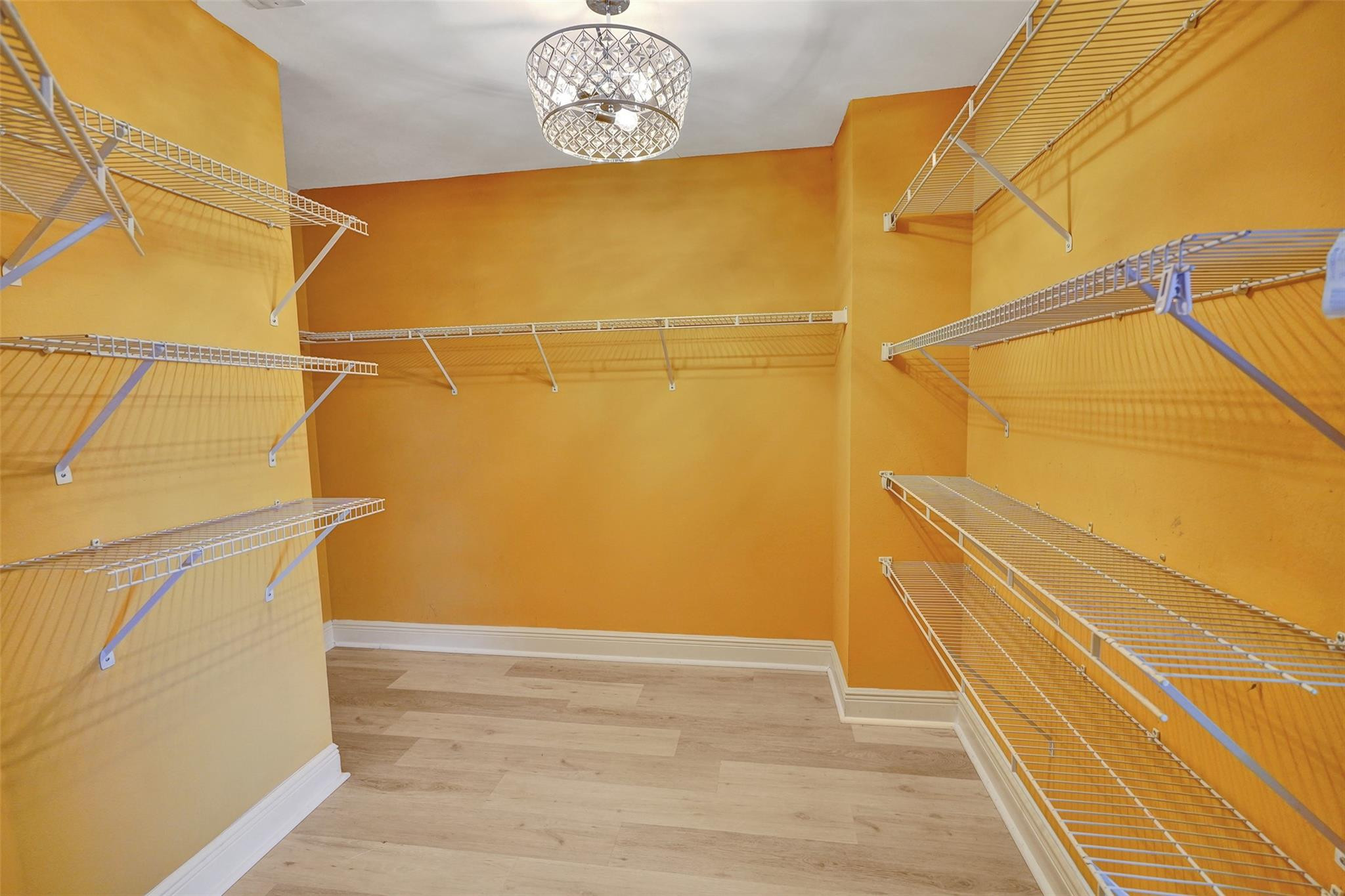 10902 Tamoron Lane Boca Raton, FL 33498 - Photo 40 of 66 a view of a room with wooden floor and door