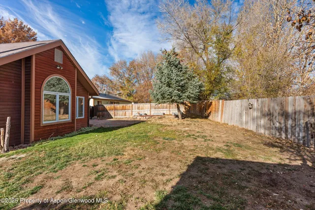a balcony with trees in front of it