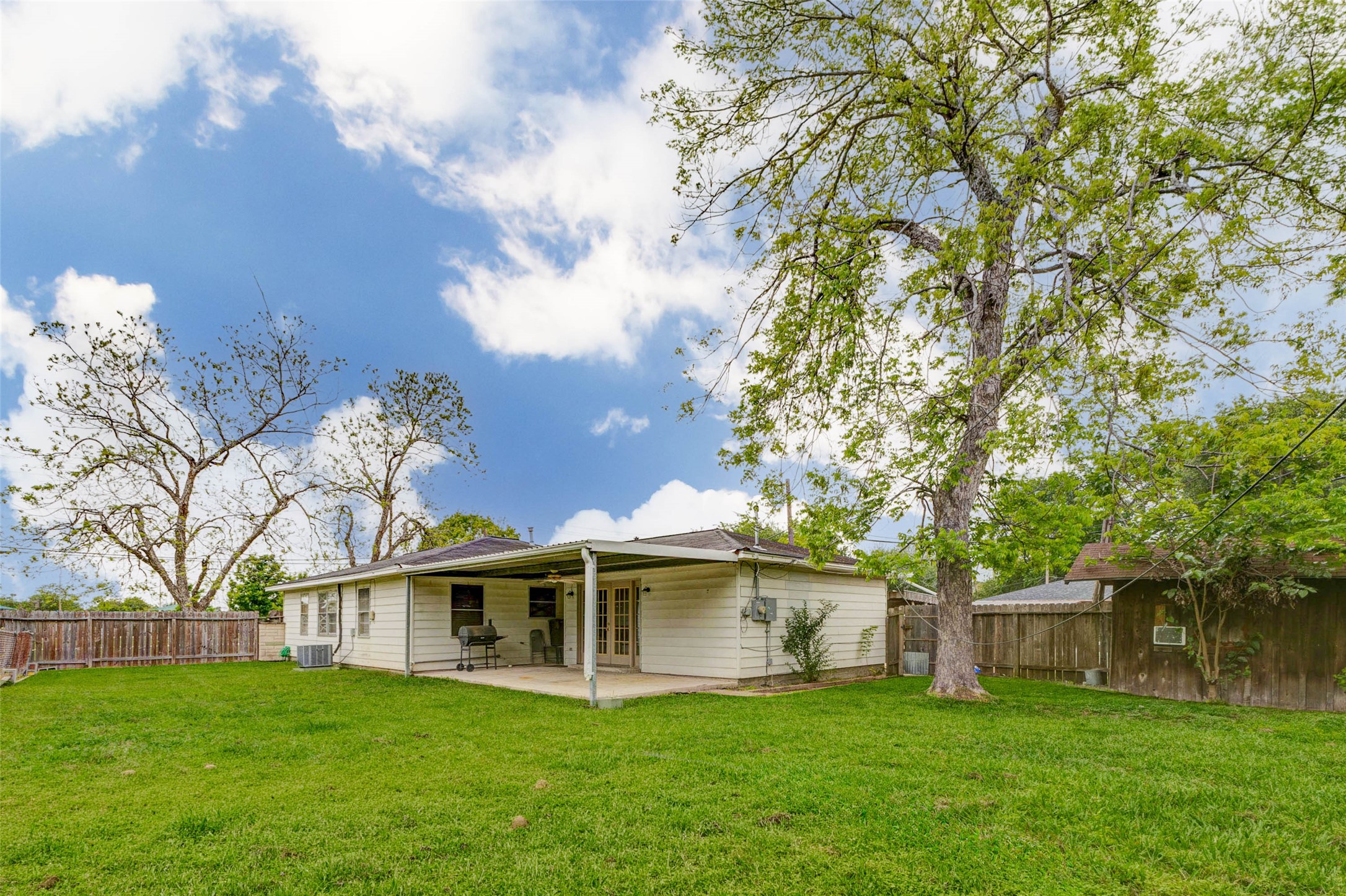 411 Burke Road Pasadena, TX 77506 - Photo 19 of 24 a view of a house with a yard