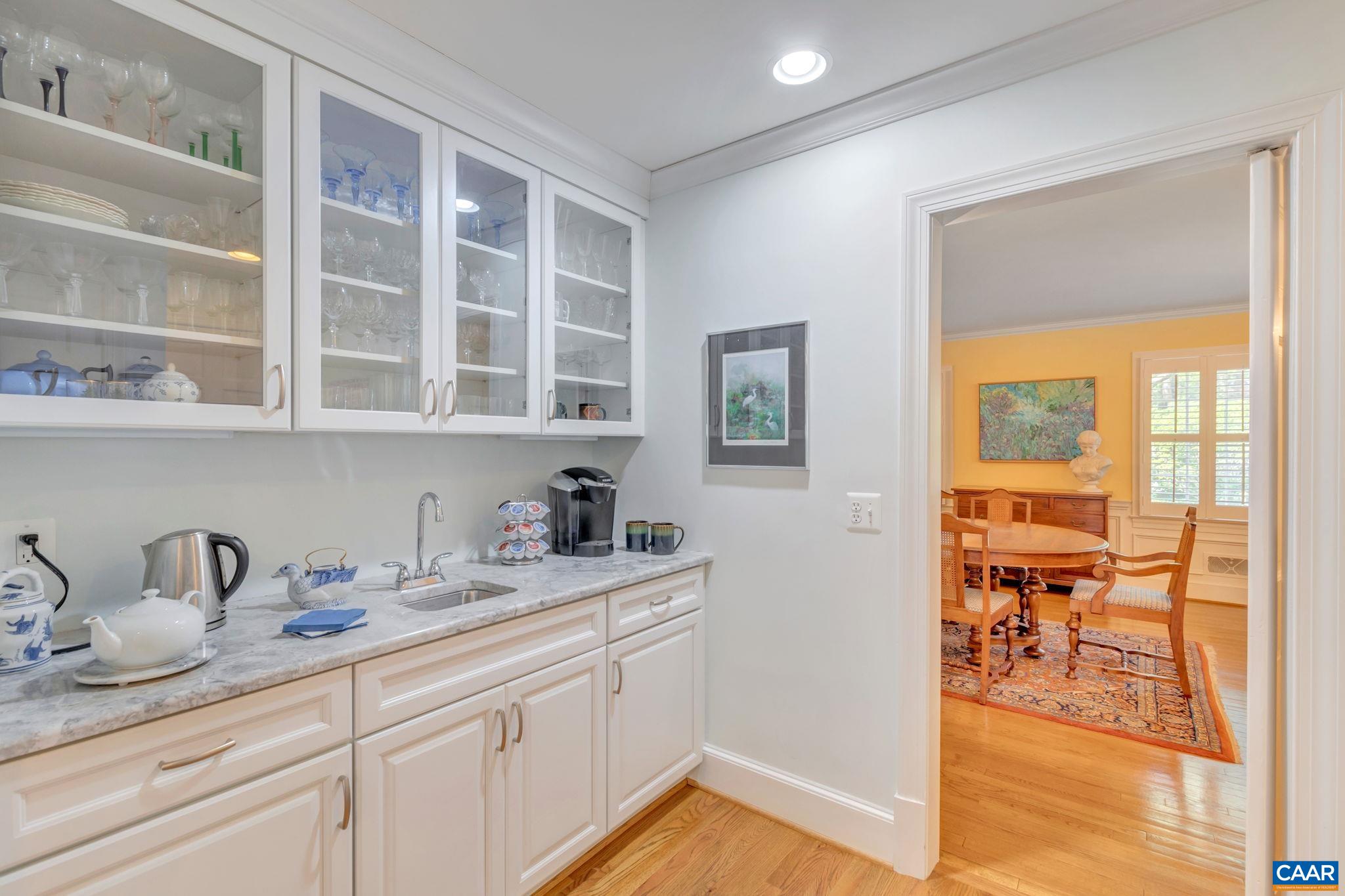 1440 Grove Road Charlottesville, VA 22901 - Photo 14 of 72 a kitchen with a sink and cabinets