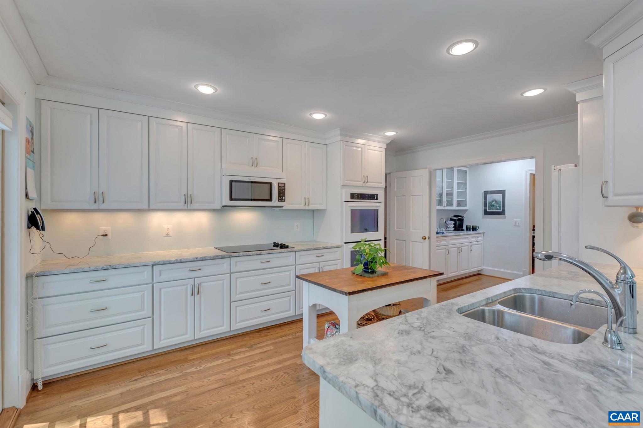 1440 Grove Road Charlottesville, VA 22901 - Photo 20 of 72 a kitchen with stainless steel appliances granite countertop a sink stove and refrigerator