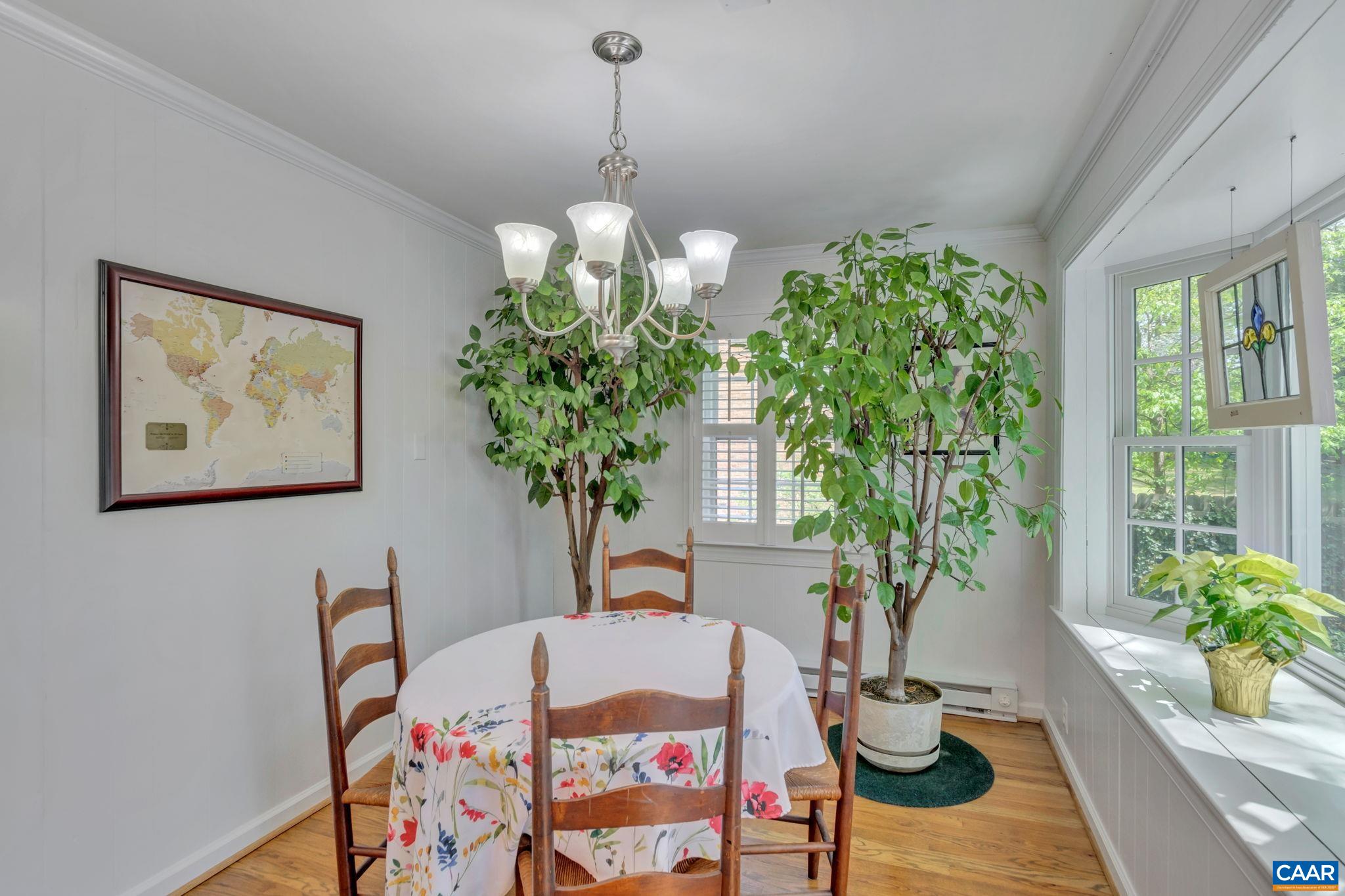 1440 Grove Road Charlottesville, VA 22901 - Photo 22 of 72 a vase of flowers sitting on a table in a bedroom