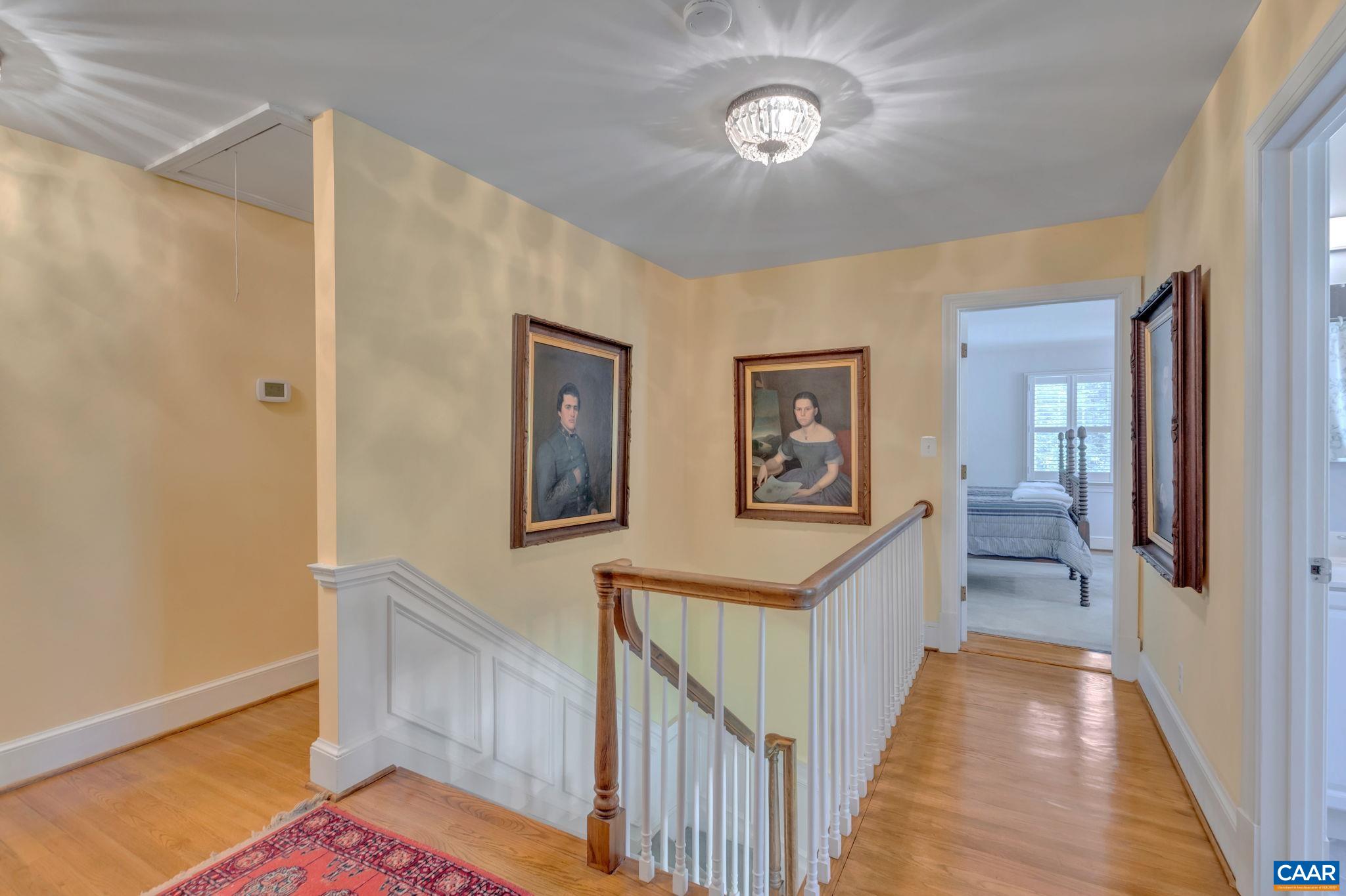 1440 Grove Road Charlottesville, VA 22901 - Photo 31 of 72 a view of a hallway to a bedroom with wooden floor and stairs