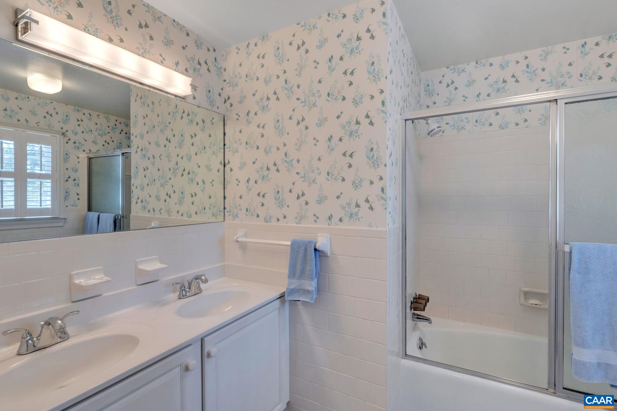 1440 Grove Road Charlottesville, VA 22901 - Photo 36 of 72 a bathroom with a sink a toilet and shower