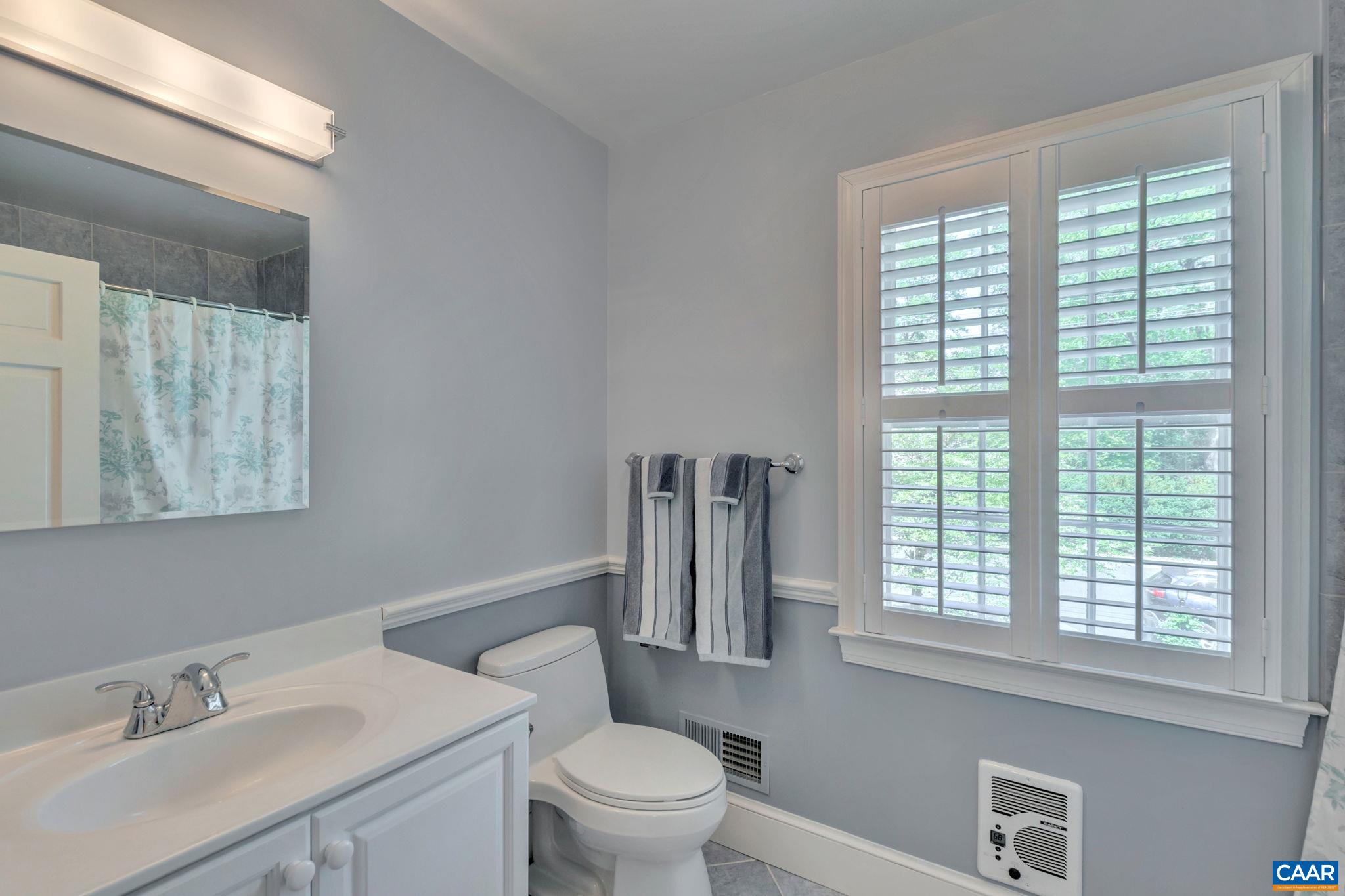 1440 Grove Road Charlottesville, VA 22901 - Photo 38 of 72 a bathroom with a sink a toilet and a window