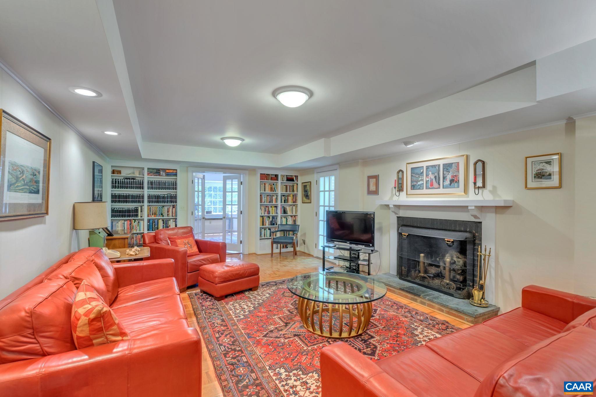 1440 Grove Road Charlottesville, VA 22901 - Photo 42 of 72 a living room with furniture fireplace and a large window