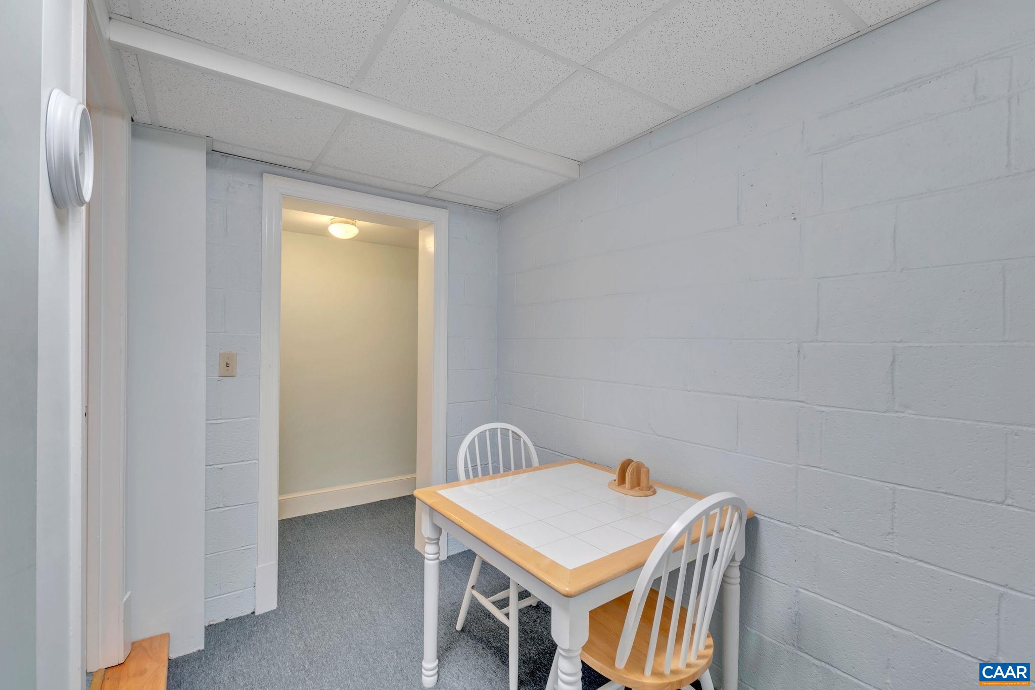 1440 Grove Road Charlottesville, VA 22901 - Photo 48 of 72 a room that has a table and chairs in it