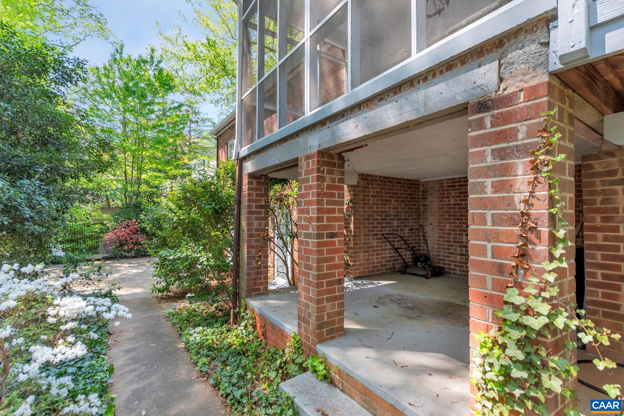 1440 Grove Road Charlottesville, VA 22901 - Photo 54 of 72 a view of a patio with table and chairs and potted plants