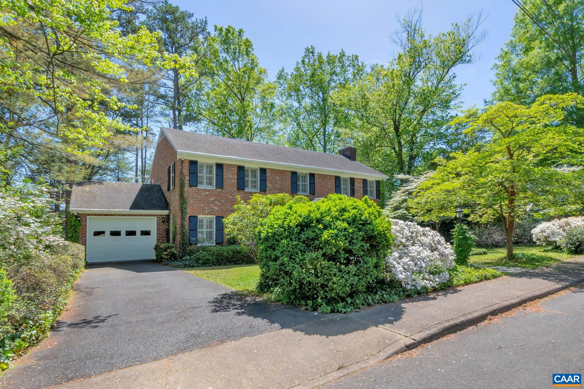 1440 Grove Road Charlottesville, VA 22901 - Photo 62 of 72 a front view of a house with a garden and trees