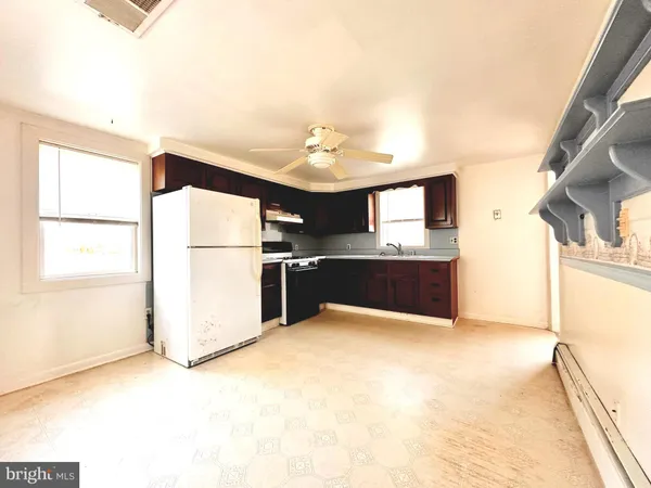 a kitchen with stainless steel appliances a refrigerator and a sink