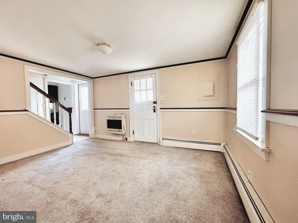 an empty room with fireplace