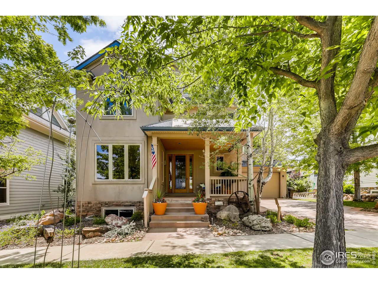 566 Dakota Boulevard Boulder, CO 80304 - Photo 1 of 24 a backyard of a house with yard and outdoor seating