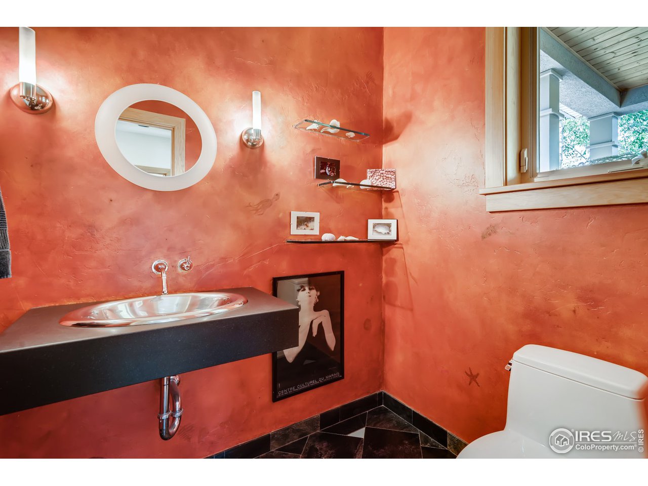 566 Dakota Boulevard Boulder, CO 80304 - Photo 11 of 24 a bathroom with a sink a mirror and a toilet