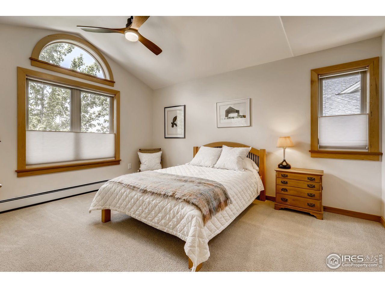 566 Dakota Boulevard Boulder, CO 80304 - Photo 16 of 24 a bedroom with a bed a dresser next to a window