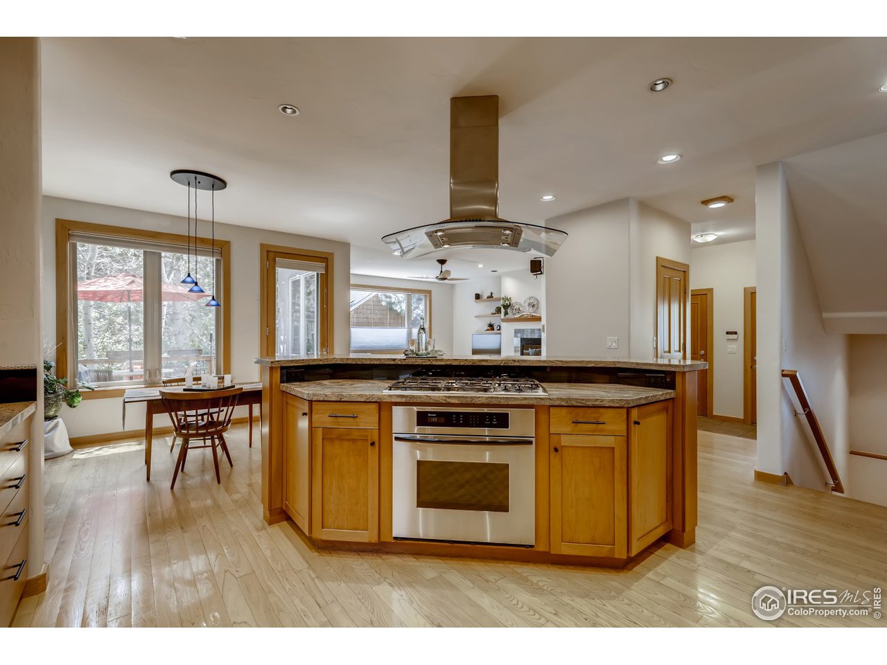 566 Dakota Boulevard Boulder, CO 80304 - Photo 5 of 24 a kitchen with stainless steel appliances granite countertop a stove and a wooden floors