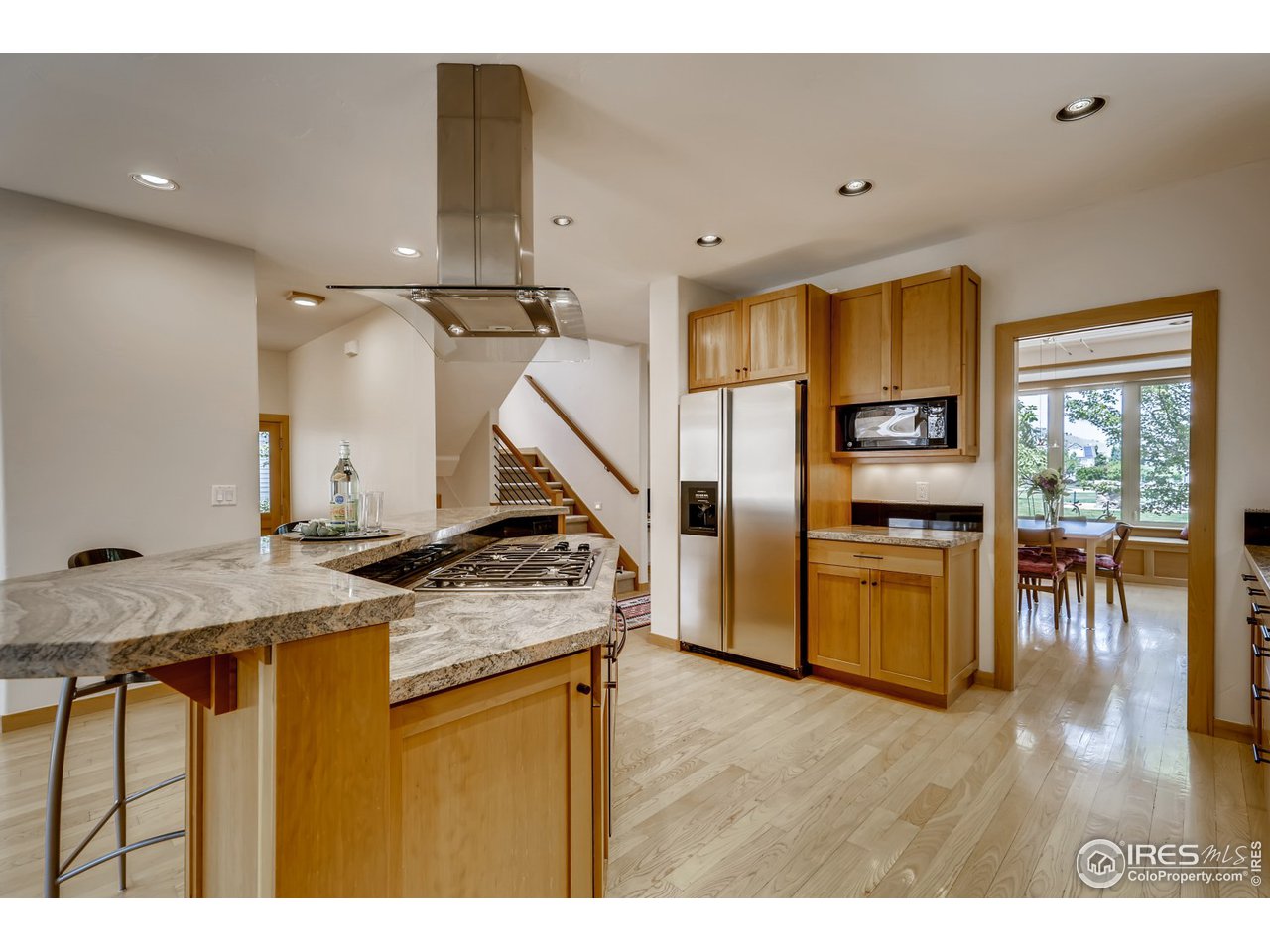 566 Dakota Boulevard Boulder, CO 80304 - Photo 7 of 24 a view of a kitchen with furniture and wooden floor